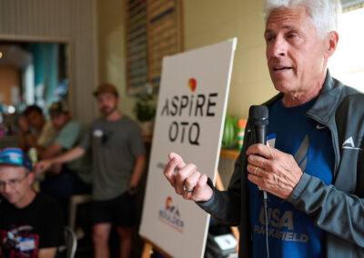 Former CU runner and Masters World Record Holder Dan King speaks at the Aspire OTQ Launch Party